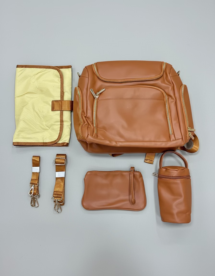 Pañalera morral con accesorios tipo cuero